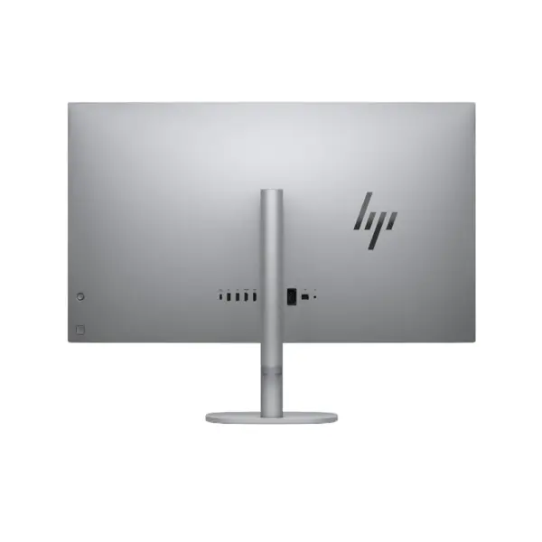 Direct rear view of HP OmniStudio X 32 All-in-One PC on a black background, highlighting the central desktop stand, I/O connectivity ports, and minimalist HP logo.