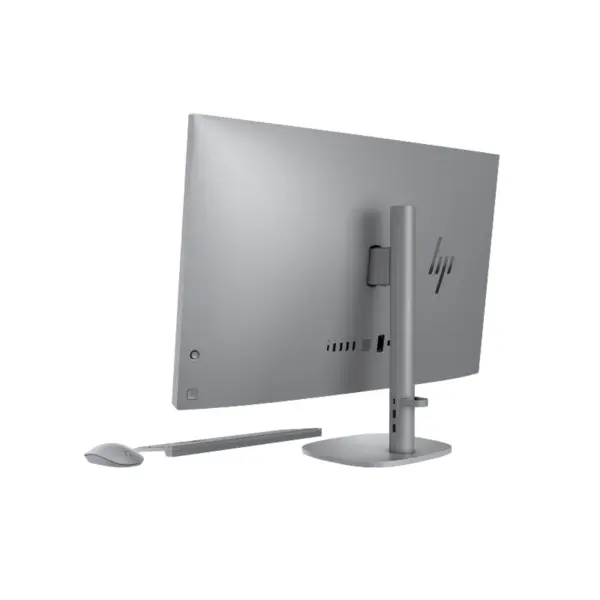 Back three-quarter perspective view of HP OmniStudio X 32 All-in-One Desktop PC showcasing its sleek silver chassis, premium vertical stand, and side ports.