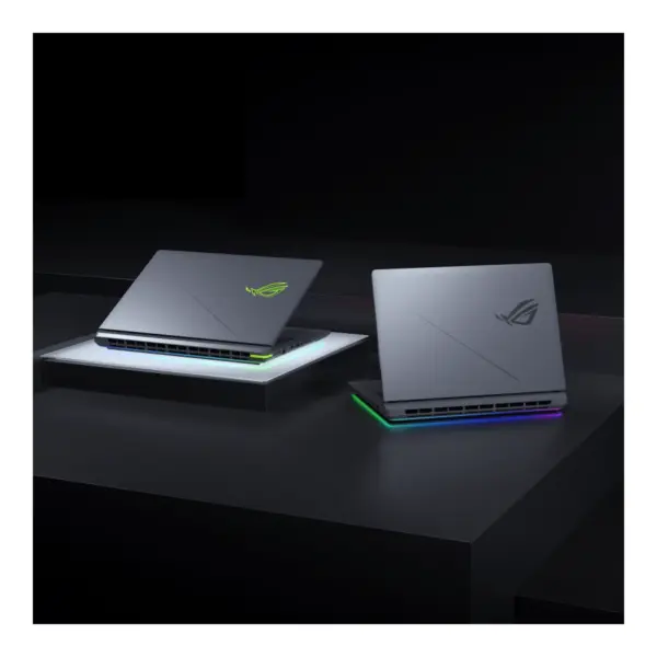 ROG Strix G16 (G615JMR) Laptop On the Surface showing Green RGB Logo and bottom RGB Lighting